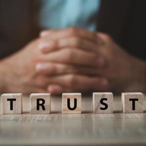 businessman-sitting-behide-the-word-trust-with-wooden-dices-on-wood-table-business-trust-concept-the-concept-of-running-a-business-requires-trust-trust-with-partners-photo businessman-sitting-behide-the-word-trust-with-wooden-dices-on-wood-table-business-trust-concept-the-concept-of-running-a-business-requires-trust-trust-with-partners-photo